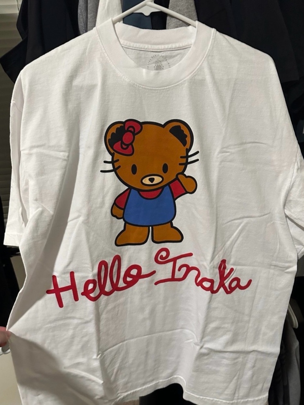 Inaka Power White Tee with Brown Bear Graphic and Red Script